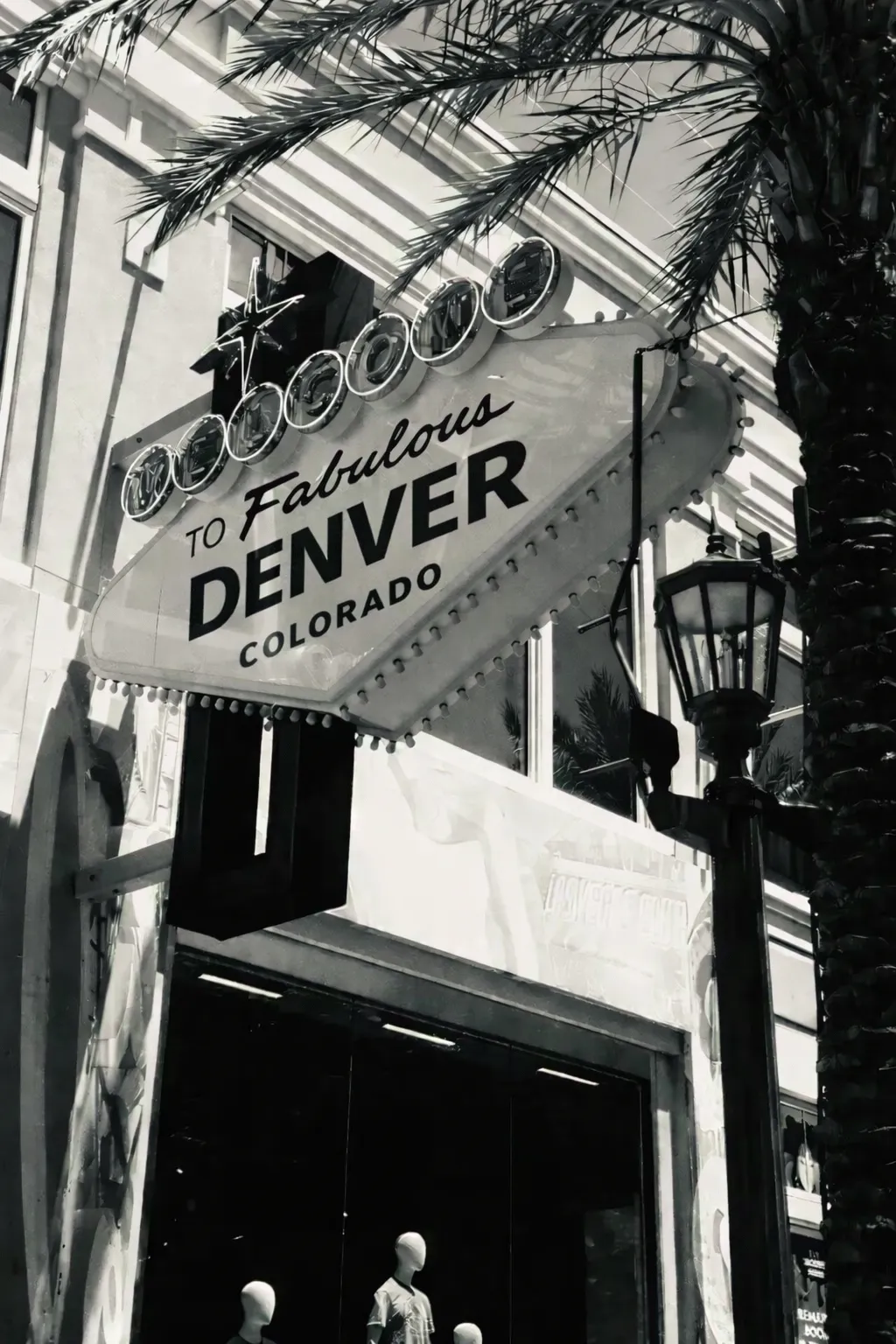 Fabulous Denver sign with palm tree and storefront, representing the vibrant culinary scene supported by Standard Restaurant Supply in Denver.